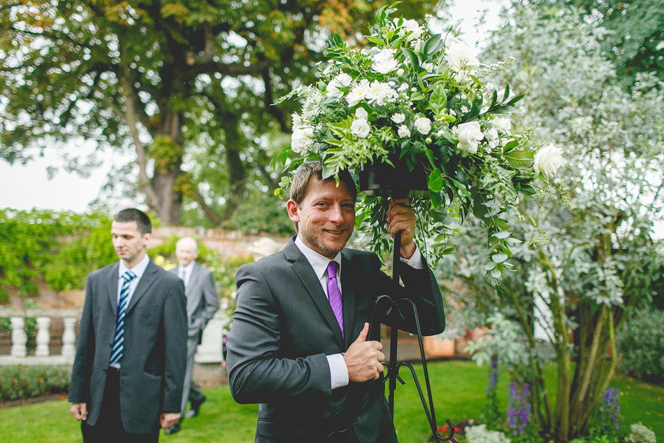 Usher carrying the wedding flowers