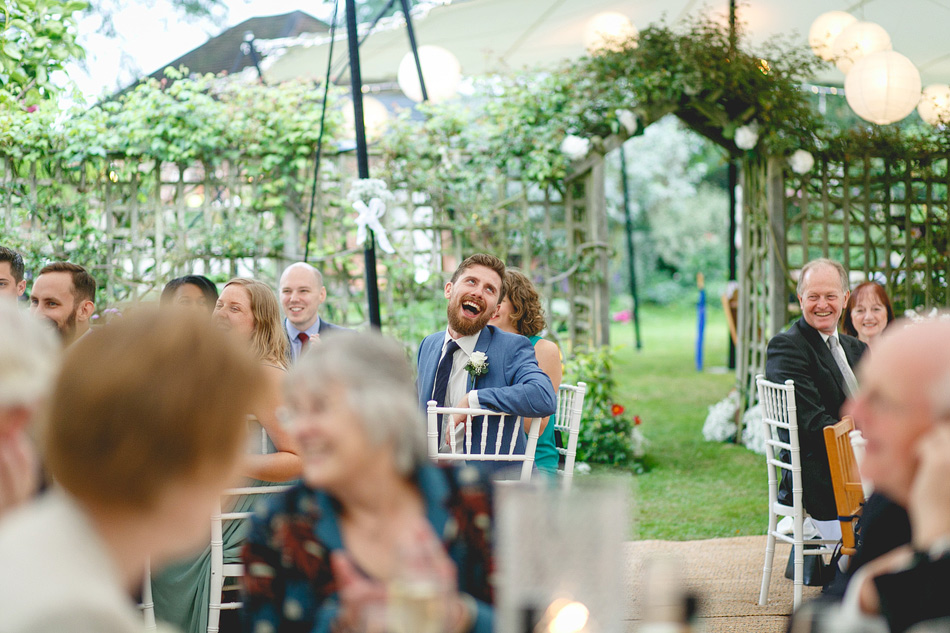 wedding guest laughing