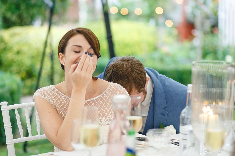 Marquee Wedding photographer bride and groom laughing