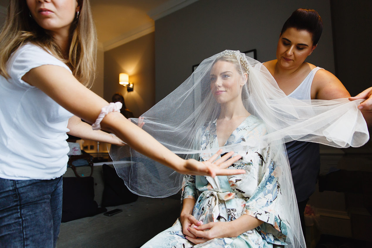 A bride gets her hair and make up done at the Ampersand Hotel - London wedding photographer